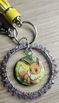 Handmade Eevee Keychain | Pokémon Bag Charm | Cute Kawaii Anime Keyring | Purple Beaded Charm with Tassel | Geek Gift for Women